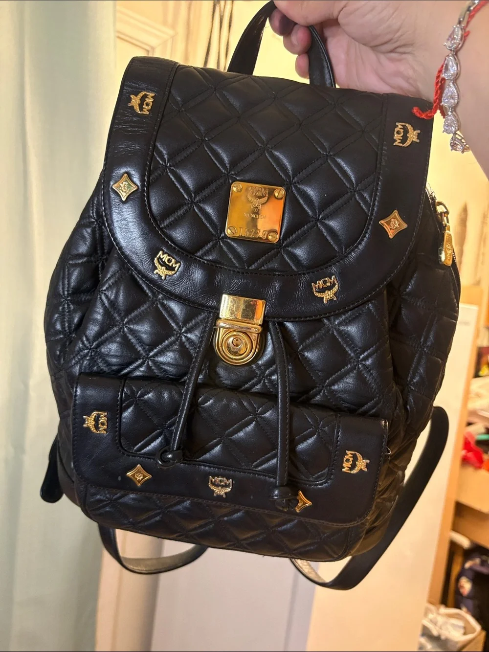 MCM Black Quilted Leather Backpack with Gold Accents